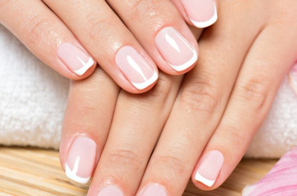 Beautiful woman's nails with french manicure